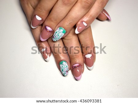 Nail design with white dots on the French manicure with pink varnish of various shades.