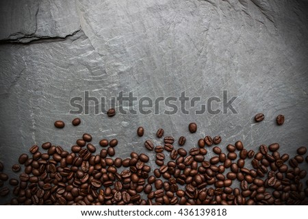 Coffee beans on black stone background Royalty-Free Stock Photo #436139818