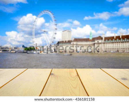 Wooden table on blurred London scenery background