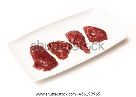 Uncooked kangaroo meat steaks  isolated on a white studio background.