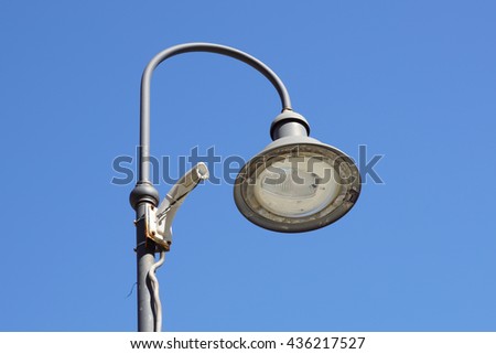 Support for broken security camera on light pole