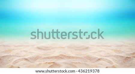 Close up sand with blurred sea sky background, summer day, copy space or for product. Panorama.