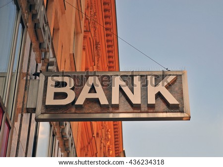 Prominent Bank Building Sign Adorning a Street-Facing Facade