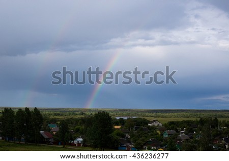 Landscape, bright rainbow after the rain.