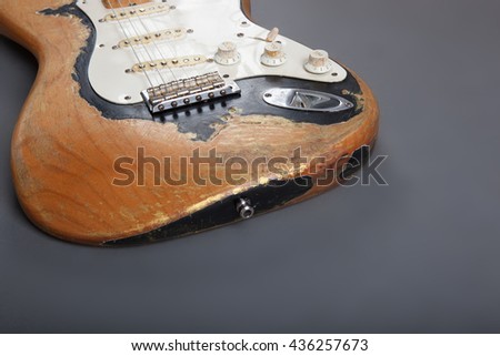 Heavy Relic Vintage electric guitar on grey background