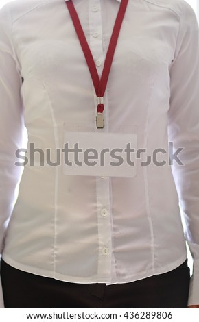 Woman wear blank white vertical badge mockup, stand isolated. Name tag on neck and chest. Person identity label. Women in shirt uniform with empty id card mock up. Business card. 