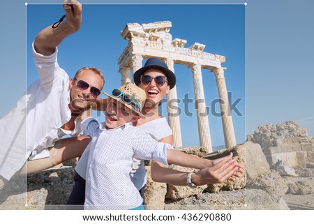 Positive young family take a sammer vacation selfie photo on antique sights view