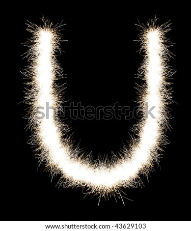 The letter U from a Bengal fire, on a black background, it is isolated.