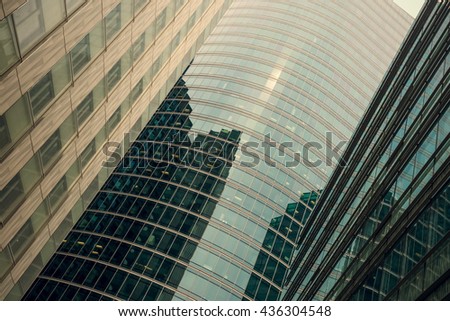 Skyscrapers with glass facade. Modern buildings in Paris business district. Concepts of economics, financial, future.  Copy space for text. Dynamic composition. Toned image
