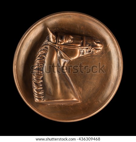 Bronze horse image on a black background