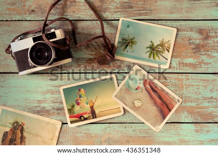Summer photo album remembrance and nostalgia of journey honeymoon trip on wood table. instant photo of vintage camera - vintage and retro style