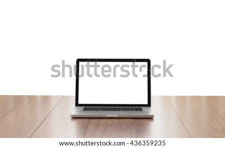 Blank screen laptop computer on wooden table isolated on white background, clipping path