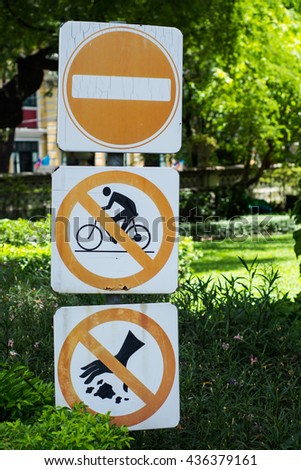 No Entry Sign, No bike and Do not litter signs display in the park