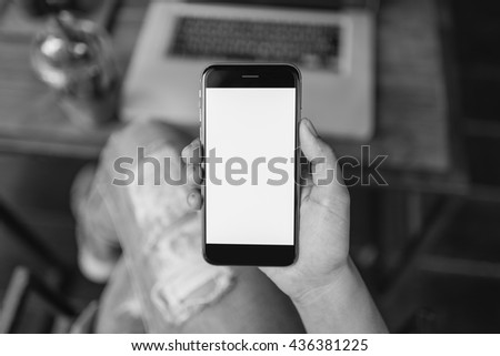 girl using smartphone in cafe. black color smartphone. 