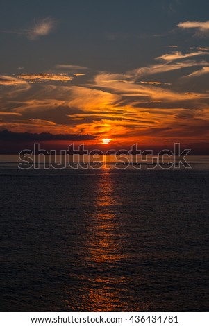The sun plunges into the sea , Mar Ligure , Liguria , Italy