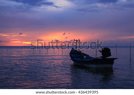 Sea view on morning time before sunrise with silhouette fishing pier on foreground,Close up,select focus with shallow depth of field:ideal use for background.
