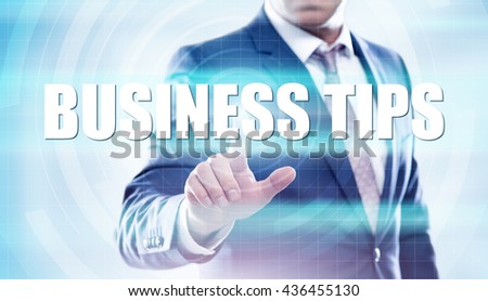A young (Middle aged) man (businessman, client, costumer) are using a virtual computer and are selecting " business tips " on the screen. Modern business, technology, internet concept.