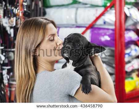 Woman Kissing French Bulldog At Store