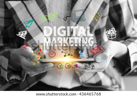 business holding a smart phone with DIGITAL MARKETING  text on black and white background ,business analysis and strategy as concept