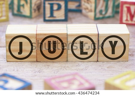July word written on wood cube