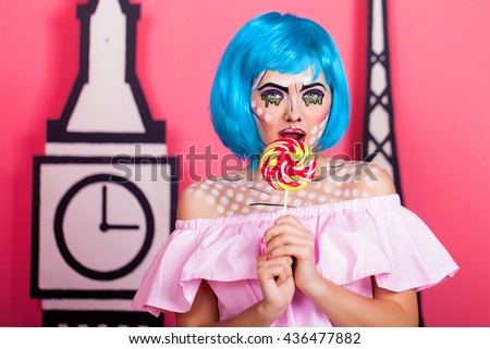 Photo of young woman with professional comic pop art make up and accessories. Creative beauty style.