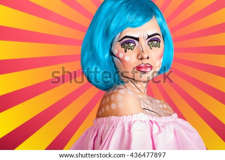 Photo of young woman with professional comic pop art make up and accessories. Creative beauty style.