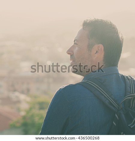 Tourist man standing in the city center during his trip in italy, selective focus and square image