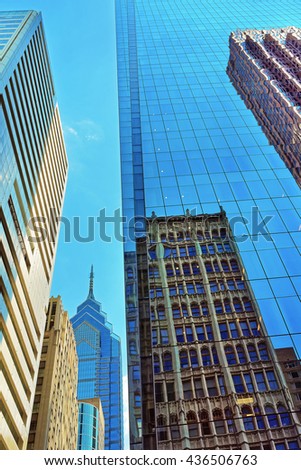 Bottom up view to skyscrapers reflected in glass in Philadelphia, Pennsylvania, USA. It is central business district in Philadelphia