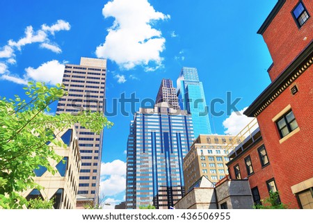 Bottom up view to skyscrapers mirrored in glass in Philadelphia, Pennsylvania, USA. It is central business district in Philadelphia