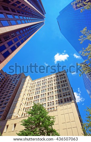 Bottom up view of skyscrapers mirrored in glass in Philadelphia, Pennsylvania, USA. It is central business district in Philadelphia
