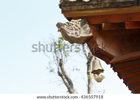 Dragon stone carving and wood roof
