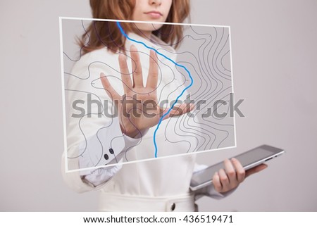 Geographic information systems concept, woman scientist working with futuristic GIS interface on a transparent screen. Royalty-Free Stock Photo #436519471