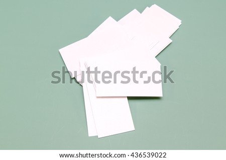 blank business cards on green background good for texte logo