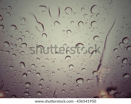 rain drops on car glass whith vintage program ,blackground
