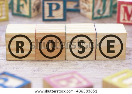 ROSE word written on wood cube