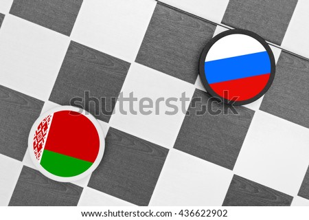 Draughts (Checkers) - Russia vs Belarus - russian sphere of influence - west / east heading of belarusian country and partnership, diplomacy, confrontation and  hybrid war Royalty-Free Stock Photo #436622902