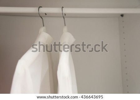 man's shirts in cabinet