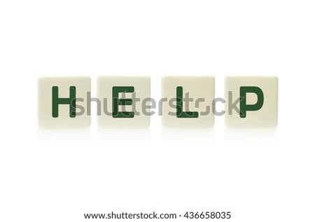 Word "Help" on board game square plastic tile pieces, isolated on a white background.