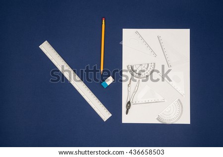 Top view of school, office or art designer accessories on a desk with copy space around products.