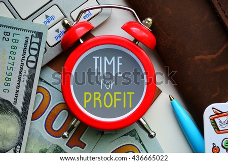 Time for profit. sign on red clock with cash