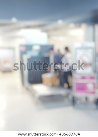 Blur abstract background of extra large baggage x-ray monitor check in at international airport.
