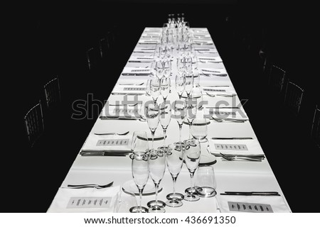 A view from above on the long table served with empty glassware