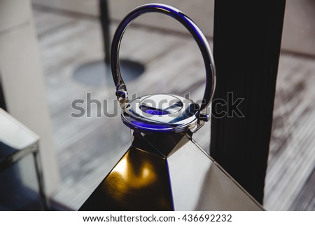 A picture of a steel lantern handle