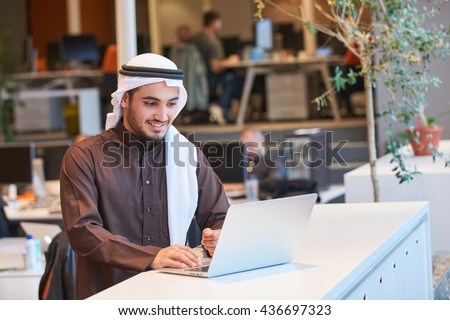 Arabian businessman working in modern office   Royalty-Free Stock Photo #436697323