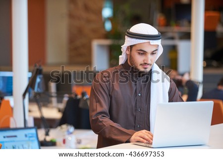 Arabian businessman working in modern office   Royalty-Free Stock Photo #436697353
