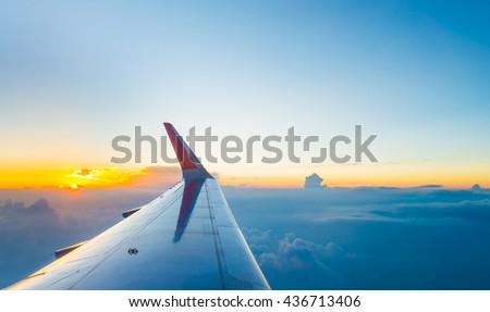 View from airplane window to see sky on evening time. Royalty-Free Stock Photo #436713406