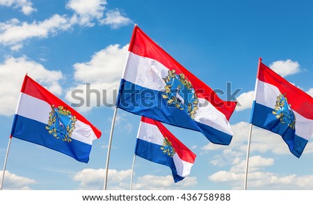 Flags of Federal Subjects of Russia. Flags of Samara region fluttering against the blue sky