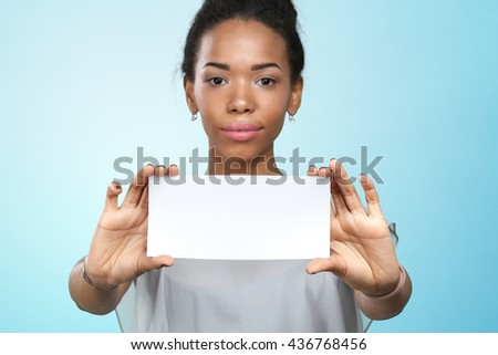 African american woman holding blank paper