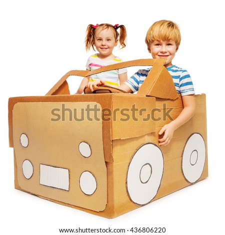 Cute kids playing a driver and the passenger
