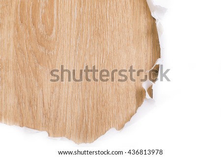 Ripped paper revealing wooden surface. Mock up